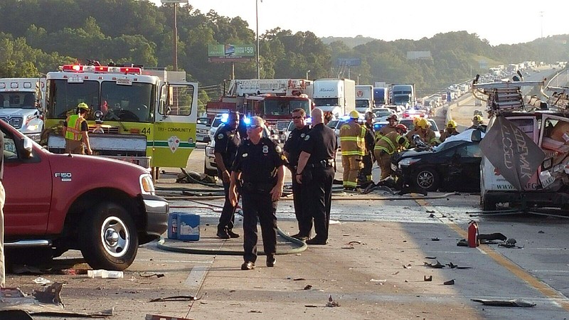 
              This photo provided by the Chattanooga Police Department shows police and emergency workers at the scene of a nine-vehicle wreck on Interstate 75 near Ooltewah, Tenn, a suburb of Chattanooga. Police in southeastern Tennessee say six people have been killed in the wreck. (Chattanooga Police Department via AP)
            