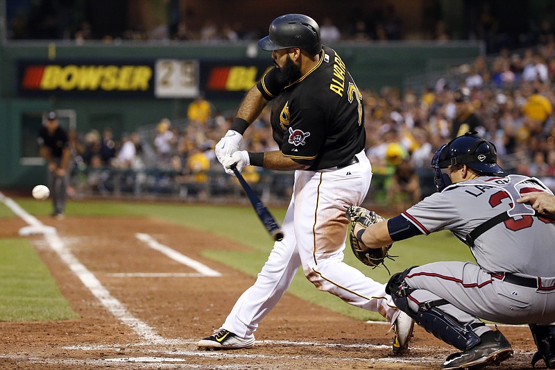 Pittsburgh Pirates' Pedro Alvarez drives in two runs with a double off Atlanta Braves relief pitcher Luis Avilan during the fifth inning of a baseball game in Pittsburgh, Friday, June 26, 2015.