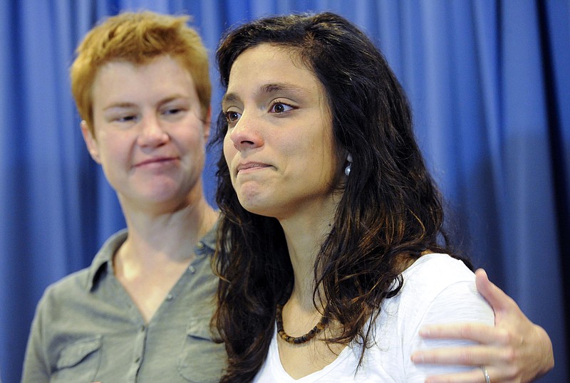 Sophy Jesty, left, and Valeria Tanco, who were plaintiffs in the U.S. Supreme Court ruling that guarantees a Constitutional right to same-sex marriage, address the media at University of Tennessee College of Law Friday, June 26, 2015, in Knoxville.