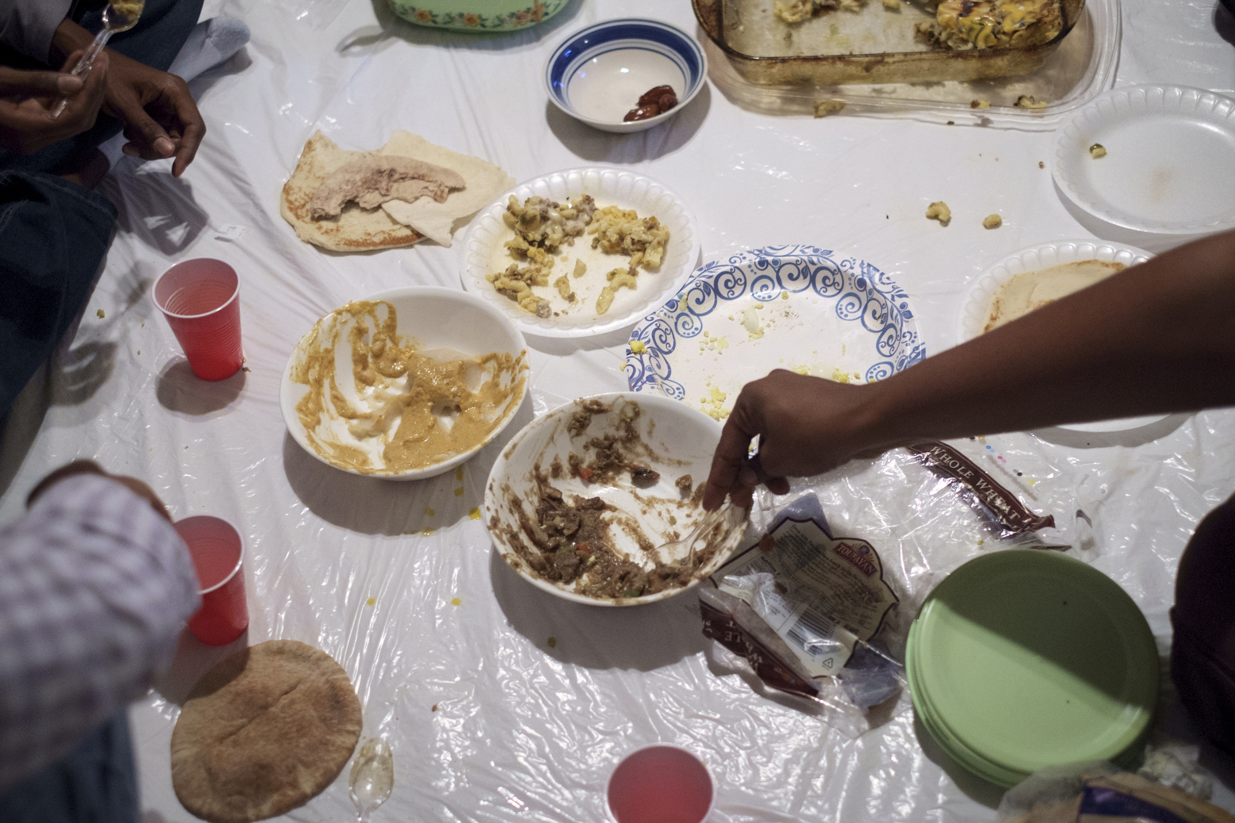 Staff photo by Doug Strickland
Friends of deceased UTC student Ali Ali gather to break their Ramadan fast together Wednesday, June 24, 2015, in an apartment in Chattanooga, Tenn. The community of Sudanese students and faculty at UTC are very close-knit, and they say they knew something was wrong when Ali did not come home for dinner the night he went missing.