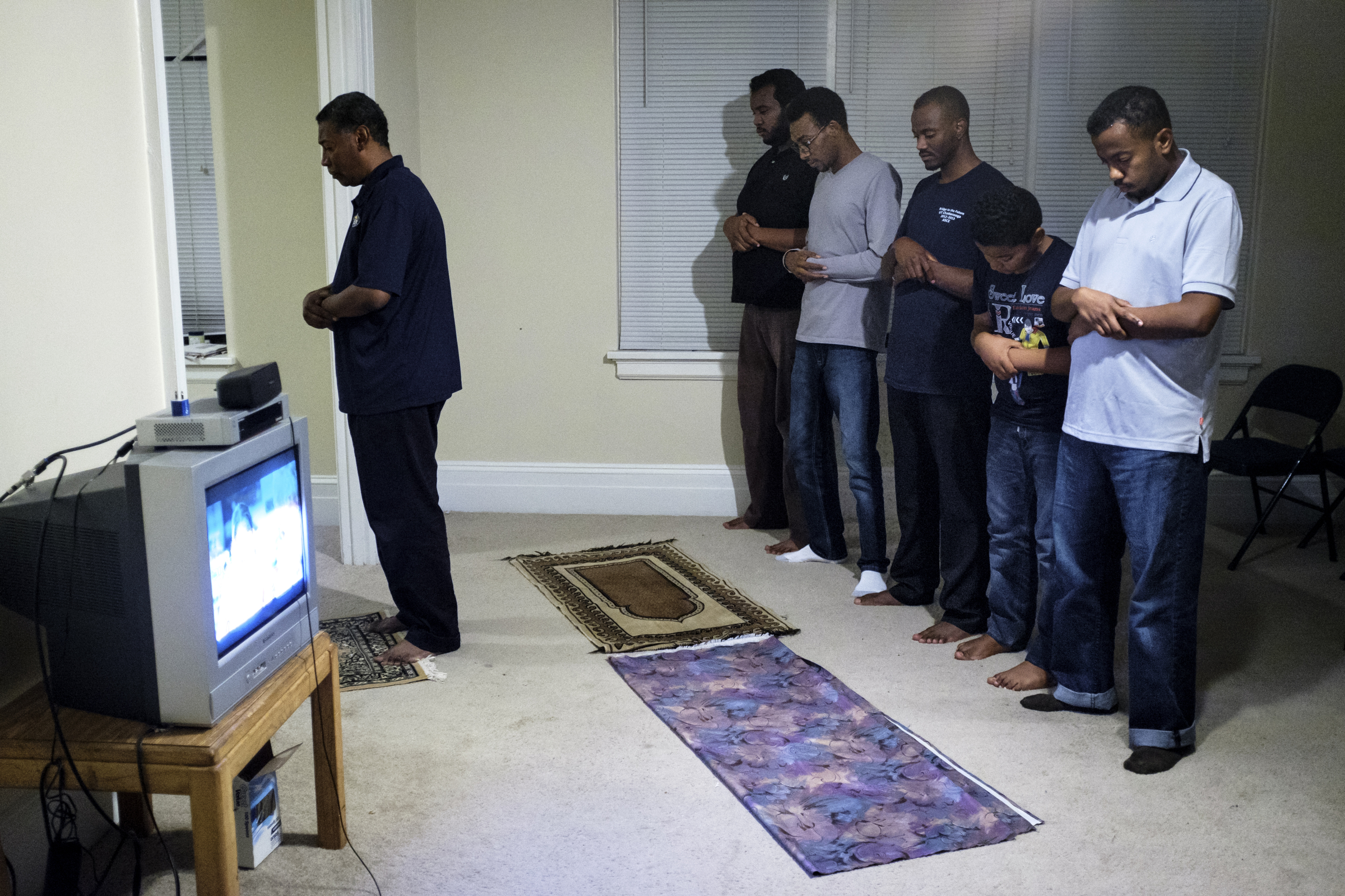 Staff photo by Doug Strickland
Friends of deceased UTC student Ali Ali pray after breaking their Ramadan fast together Wednesday, June 24, 2015, in an apartment in Chattanooga, Tenn. The community of Sudanese students and faculty at UTC are very close-knit, and they say they knew something was wrong when Ali did not come home for dinner the night he went missing.