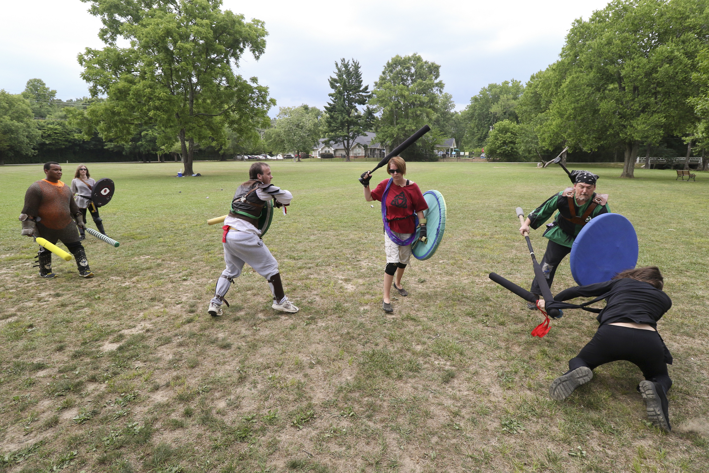 Staff Photo by Dan Henry. Participants battle during an Amtgard practice at Heritage Park in East Brainerd, Tenn., on Wednesday, June 24, 2015. Amtgard is an international organization where players use padded weapons to battle each other in medieval and fantasy based game scenarios.