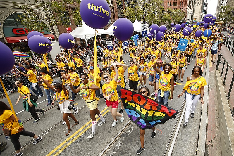 Kaiser Permanente group of employees and family members march during the 45th annual San Francisco Gay Pride parade Sunday, June 28, 2015, in San Francisco. A large turnout was expected for gay pride parades across the U.S. following the landmark Supreme Court ruling that said gay couples can marry anywhere in the country.