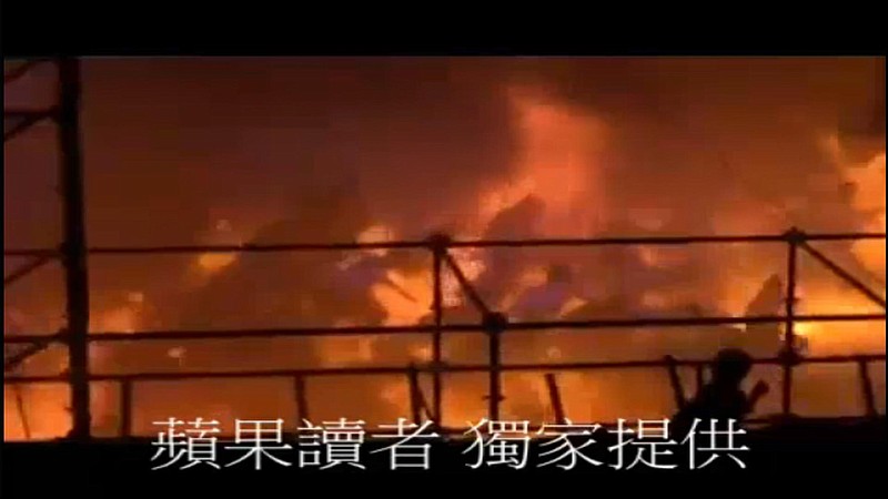 In this screen grab taken from UGC by Apple Daily Taiwan, concert goers run as a fire starts at the Formosa Water Park in New Taipei City, Taiwan, Saturday, June 27, 2015. 
