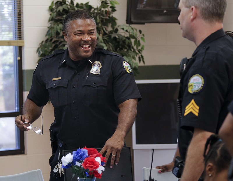 Staff photo by Doug Strickland
Police Lt. Pedro Bacon, left, talks with Sgt. Brian Russell during a thank-you celebration honoring Lt. Bacon and Capt. Edwin McPherson on Thursday, June 25, 2015, at Eastdale Recreation Center in Chattanooga, Tenn. North Brainerd residents honored the two police officers for their work in the past 18 months to help better their community.