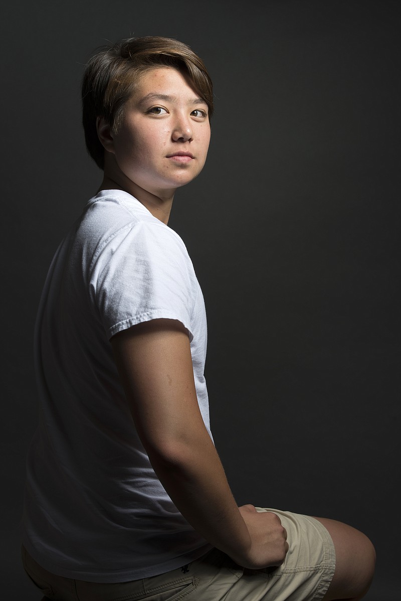 
              In this June 22, 2015 photo, Schuyler Bailar poses for a photo in Washington. Recruited as a woman to swim for Harvard, he will now swim for the men's team after transitioning from a female to a male in the last year. (Marvin Joseph/The Washington Post via AP)
            