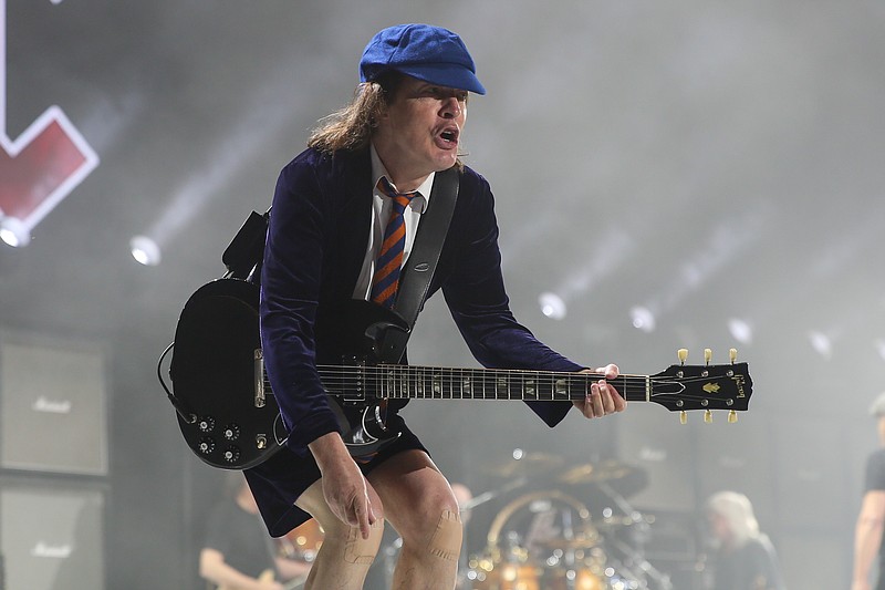 
              FILE - In this April 17, 2015 file photo, Angus Young of AC/DC performs at the 2015 Coachella Music and Arts Festival in Indio, Calif. AC/DC is finally heading to Spotify, three years after the veteran rock band decided to put its catalog on iTunes. A person familiar with the situation told The Associated Press on Monday, June 29, 2015, that AC/DC’s music would be available on Spotify globally Tuesday.  (Photo by Rich Fury/Invision/AP, File)
            