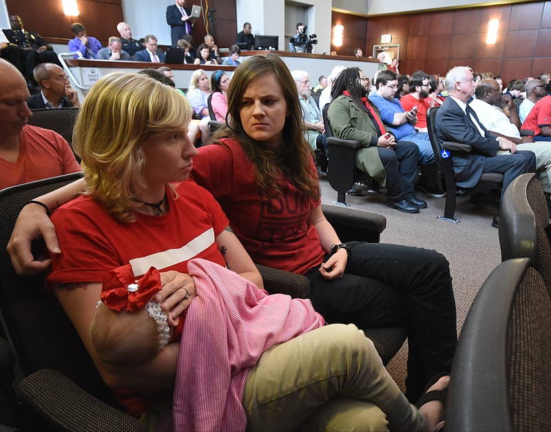 Staff photo by Tim Barber
Inside the Chattanooga City Council meeting Tuesday, recently married partners Val Hill, left, and Megan Turner await the upcoming Non-Discrimination Ordinance to be taken up at the June 30, 2015, meeting.
