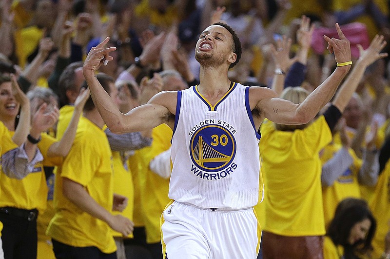 
              FILE - In this Wednesday, May 13, 2015, file photo, Golden State Warriors guard Stephen Curry reacts after scoring during the first half of Game 5 in a second-round NBA playoff basketball series against the Memphis Grizzlies in Oakland, Calif. Curry has surpassed the Cleveland Cavaliers' LeBron James for the most popular jersey in the NBA. (AP Photo/Ben Margot, File)
            