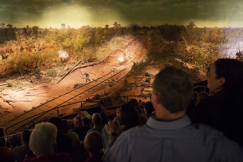 Visitors view the Atlanta Cyclorama, the colossal Civil War painting created about 130 years ago, Tuesday, June 30, 2015, in Atlanta.