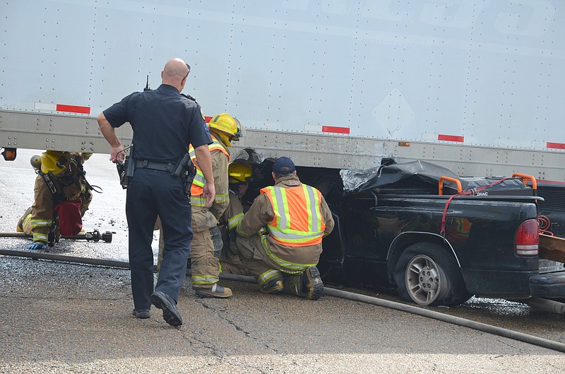Police and firefighters shut down Amnicola Highway today after a pickup truck and a semi-truck collided around 10 a.m. at the intersection of Amnicola and Creekside Road.