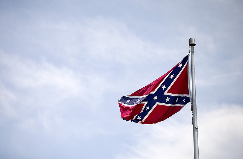 A Confederate flag flies at the base of Stone Mountain on Tuesday, June 30, 2015, in Stone Mountain, Ga.