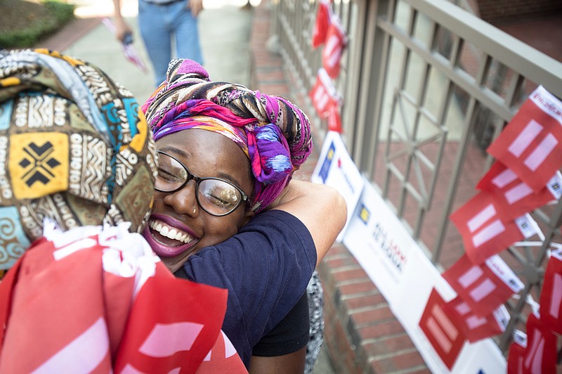 Tori Wolfe-Sisson embraces a friend while gathering to celebrate the Supreme Court decision on same sex marriage outside the Montgomery County Courthouse on Friday, June 26, 2015, in Montgomery, Ala.