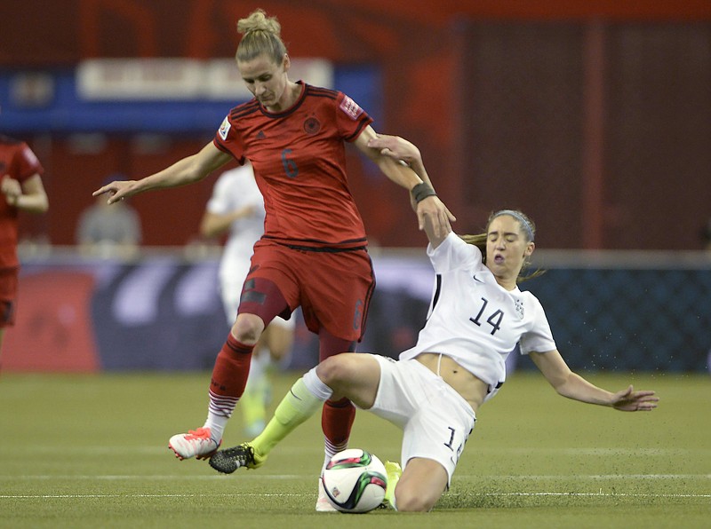 Germany's Simone Laudehr (6) and United States' Morgan Brian (14) battle for the ball during the first half of a semifinal in the Women's World Cup soccer tournament, Tuesday, June 30, 2015, in Montreal, Canada.