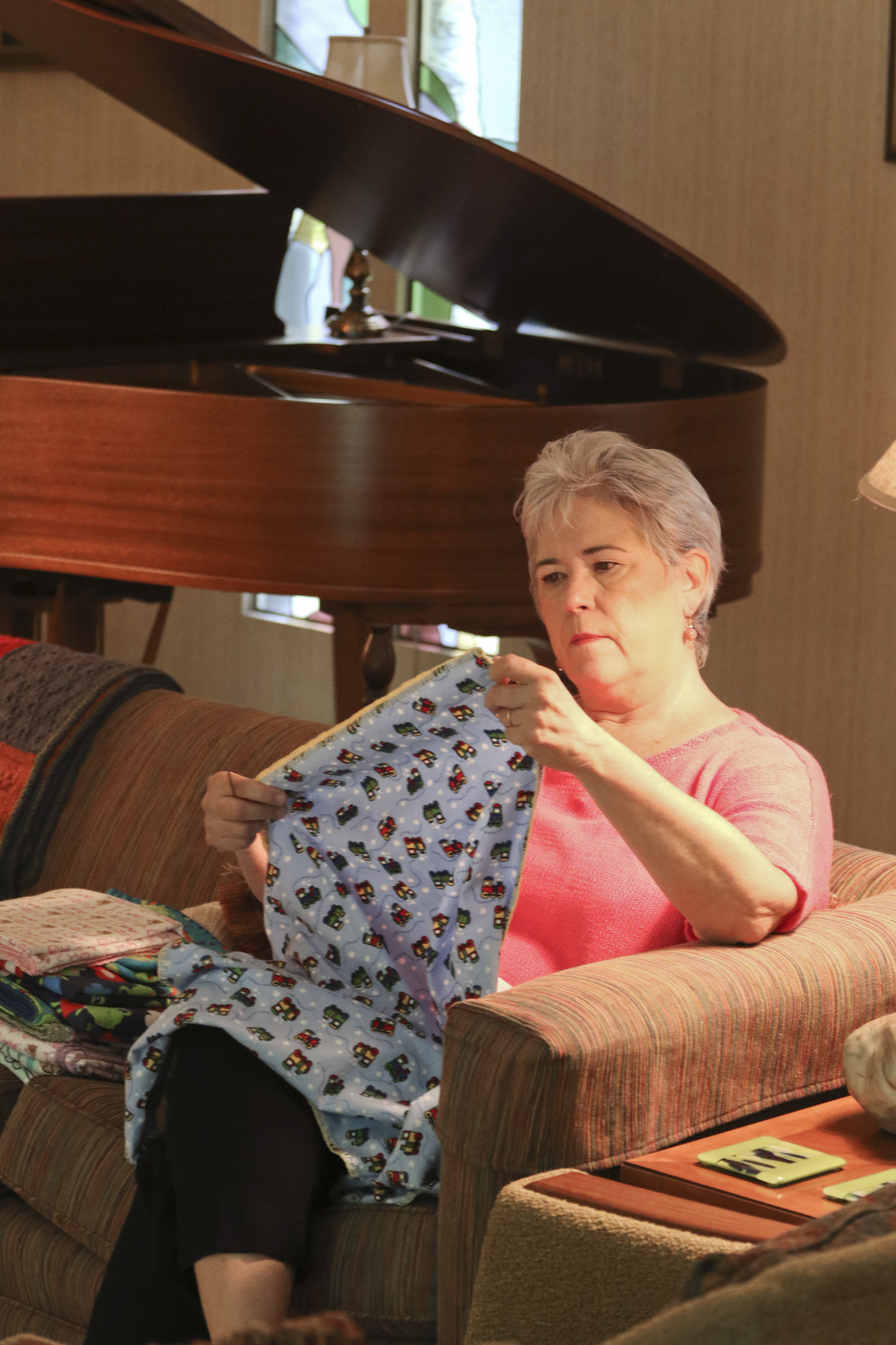 Staff Photo by Dan Henry. Nancy Hall crochets baby blankets to sell on her MyParadeDesigns storefront on Etsy.