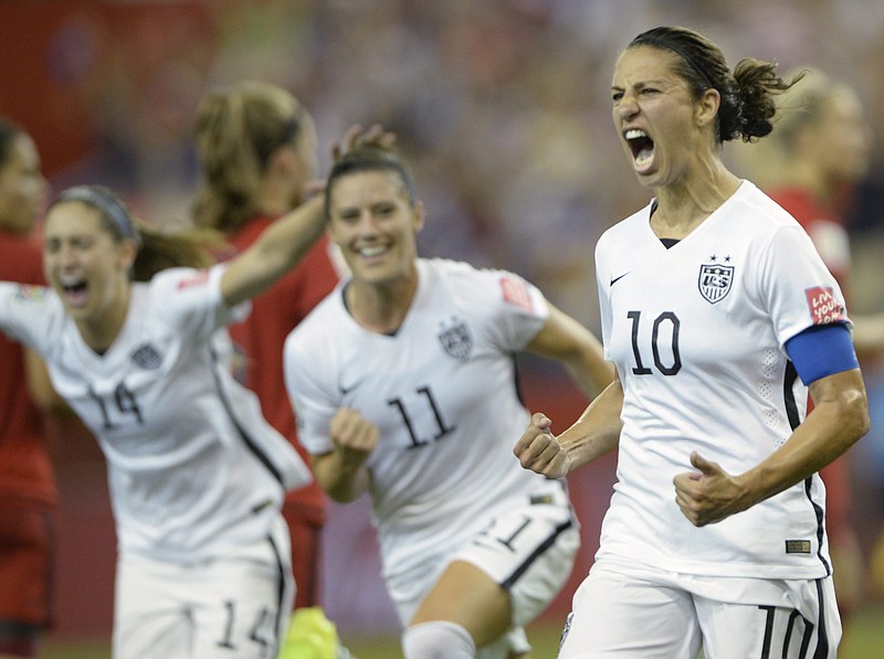 The United States' Carli Lloyd (10) celebrates with teammates Ali Krieger (11) and Morgan Brian after scoring on a penalty kick during Tuesday night's World Cup semifinal against Germany in Montreal, Canada. The U.S. women will face Costa Rica at Finley Stadium on Aug. 19, an exhibition match that sold out just hours after tickets went on sale Wednesday. Photo by The Associated Press.