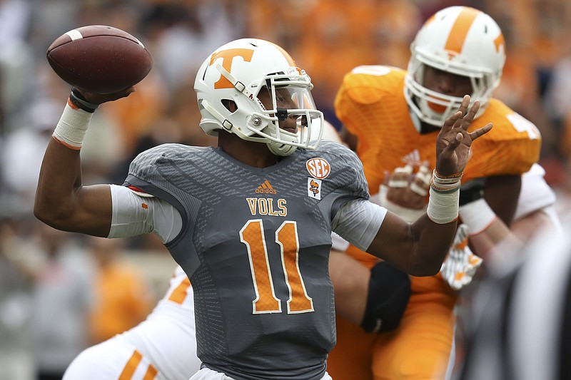 Staff Photo by Dan Henry / The Chattanooga Times Free Press- 4/25/15. The University of Tennessee's Joshua Dobbs (11) winds up to throw during the Dish Orange & White Game in Knoxville on Saturday, April 25, 2015.