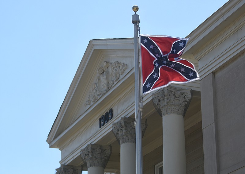 Staff Photo by Angela Lewis Foster/ The Chattanooga Times Free Press- 4/08/15.
A Confederate flag flies above the Chattooga County Courthouse Wednesday in Summerville, Ga.