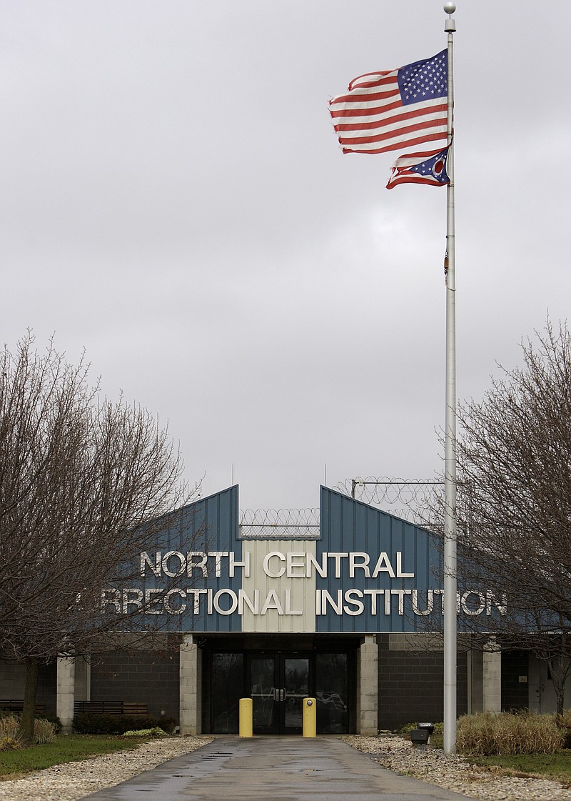 
              FILE - This Nov. 21, 2011 photo shows the main entrance to North Central Correctional Institution, in Marion, Ohio. The state could sell the central Ohio prison to a private prison operator, creating the second privately owned and operated correctional institutions in the state, under a bill on the way to Ohio Gov. John Kasich. The legislation approved last month authorizes the state to put North Central Correctional Institution up for sale on the condition it continues to be run as a prison.  (AP Photo/Jay LaPrete, File)
            