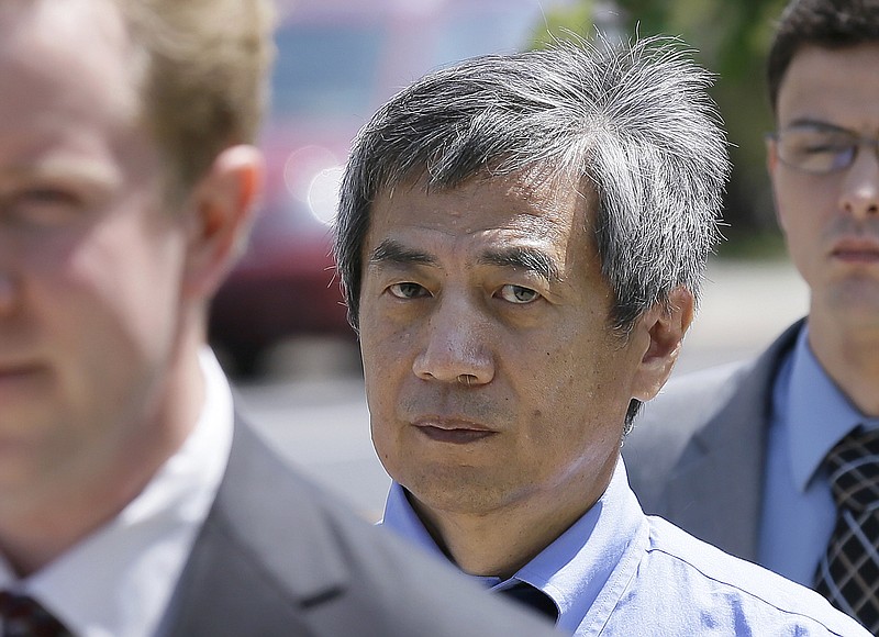 
              FILE - In this July 1, 2014 file photo, former Iowa State University researcher Dong-Pyou Han leaves the federal courthouse in Des Moines, Iowa. Han, who pleaded guilty in February to making false statements about a potential HIV vaccine in research reports, was sentenced Wednesday, July 1, 2015 to 4 and one half years in prison and must repay a federal government agency more than $7 million. (AP Photo/Charlie Neibergall, File)
            