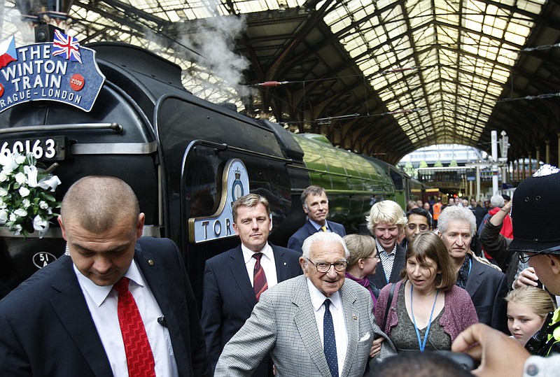 Nicholas Winton who organized the Winton Train rescue of children walks through Liverpool Street station in London in this  2009 file photo.