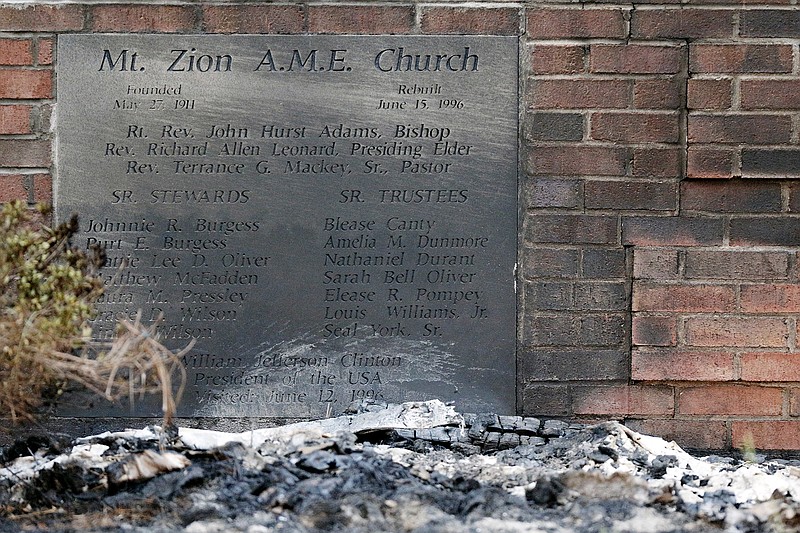 Ashes lie by a cornerstone outside Mount Zion African Methodist Episcopal Church on Wednesday, July 1, 2015, in Greeleyville, S.C.