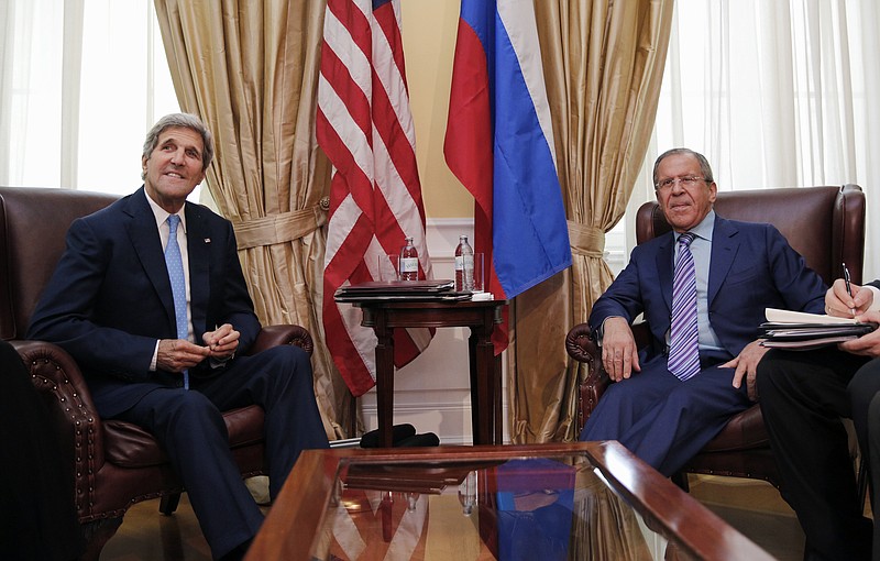 In this June 30, 2015, photo, U.S. Secretary of State John Kerry meets with Russian Foreign Minister Sergey Lavrov at a hotel in Vienna, Austria.