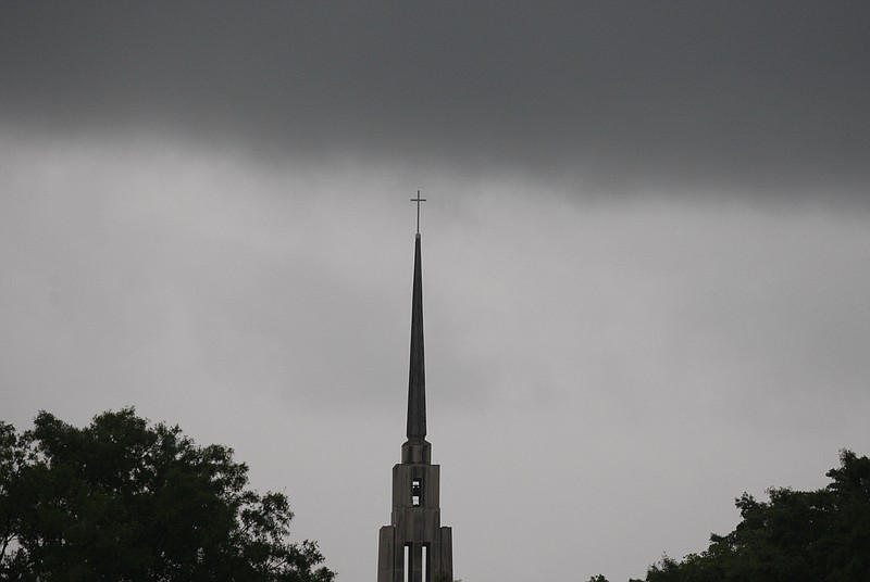 Staff File Photo by Doug StricklandDamage from various storms, like the thunderstorm gathering here over the steeple of First-Centenary United Methodist Church, are partly to blame for EPB's recent rate rise.
