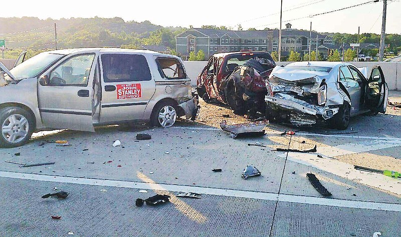 Debris covers the highway after a multiple-fatality wreck at Exit 11 in Ooltewah. (Chattanooga Police Department Photo by Craig Joel)