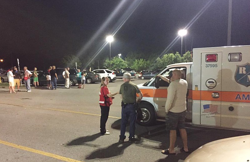 
              Emergency personnel stand by as evacuees gather at the Foothills Mall early Thursday, July 2, 2015, in Maryville, Tenn.,  after they were forced to leave their homes when rail car carrying a flammable and toxic gas has derailed and caught fire. (Brittany Bade/WBIR.com via AP)
            