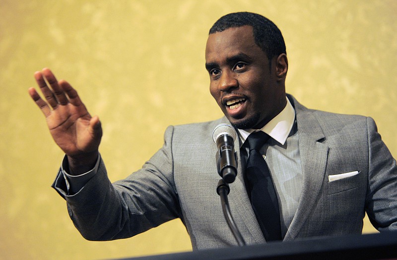 
              FILE - In this July 26, 2013 file photo, Sean "Diddy" Combs of the new network Revolt TV addresses reporters at the Beverly Hilton Hotel in Beverly Hills, Calif.  The Los Angeles County district attorney's office has declined to file felony charges against Combs for a confrontation in June 2015 at the University of California, Los Angeles, where his son plays football. District attorney spokesman Ricardo Santiago said Thursday, July 2, 2015, his office has decided instead to turn the case over to the Los Angeles city attorney's office.  (Photo by Chris Pizzello/Invision/AP, File)
            