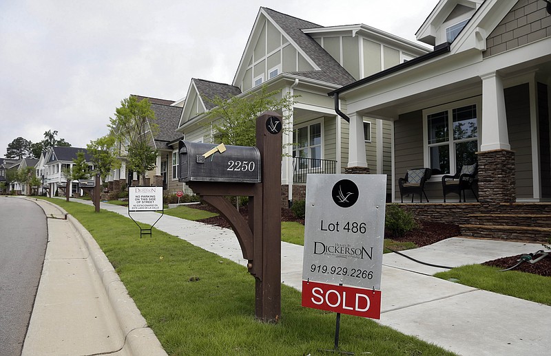 
              In this photo taken Tuesday, June 9, 2015 a sold sign is displayed in the yard of a newly constructed home in the Briar Chapel community in Chapel Hill, N.C. Average long-term U.S. mortgage rates rose this week, reaching high levels for the year, according to data published by mortgage giant Freddie Mac on Thursday, July 2, 2015. (AP Photo/Gerry Broome)
            