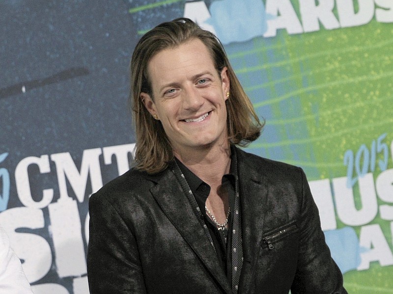 
              FILE - In this June 10, 2015 file photo, Tyler Hubbard, of Florida Georgia Line, arrives at the CMT Music Awards in Nashville, Tenn. Hubbard married Idaho native Hayley Stommel in Sun Valley,  Idaho on Wednesday, July 1. (Photo by Sanford Myers/Invision/AP, File)
            