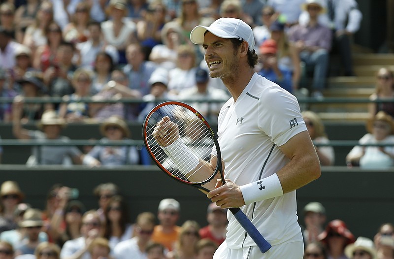 
              Andy Murray of Britain celebrates after winning the single match against Robin Haase of the Netherlands, at the All England Lawn Tennis Championships in Wimbledon, London, Thursday July 2, 2015. Murray won 6-1, 6-1, 6-4. (AP Photo/Alastair Grant)
            