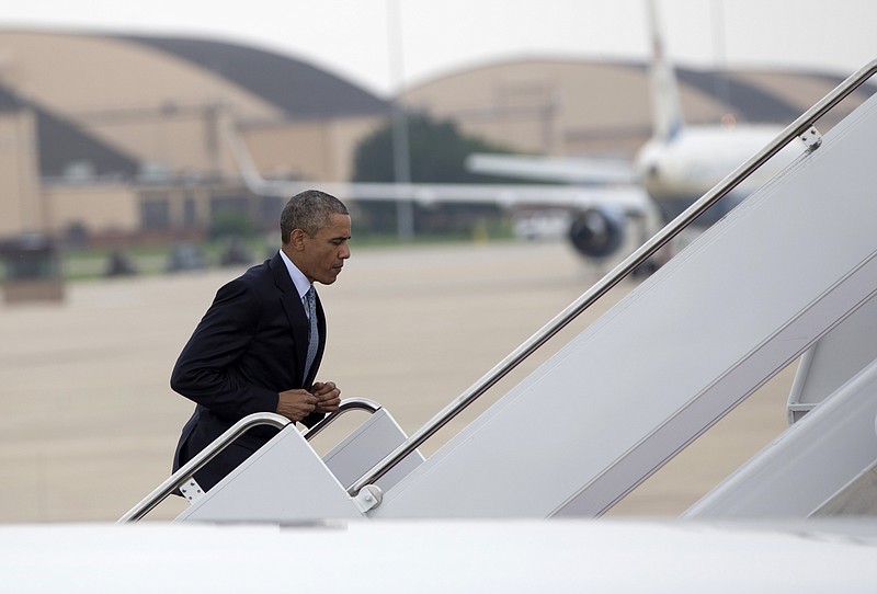 
              President Barack Obama runs up the stairs to board Air Force One, Thursday, July 2, 2015, at Andrews Air Force Base, Md., en route to La Crosse, Wis., where he is to speak  at the University of Wisconsin at La Crosse about economy and to promote a proposed Labor Department rule that would make more workers eligible for overtime.  (AP Photo/Carolyn Kaster)
            