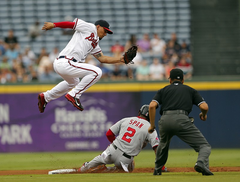 Washington Nationals' Denard Span (2) steals second base as Atlanta Braves second baseman Jace Peterson (8) leaps for the high throw in the first inning of a baseball game Thursday, July 2, 2015, in Atlanta. 