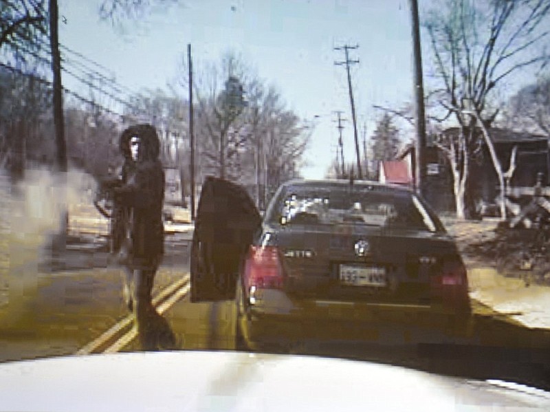 A frame from a video recorded by the in-cruiser camera of Knoxville Police Officer Andrew Olson shows Cameron Cook firing a shot gun at Olson in Feb. 2011. The video was shown in court on March 1, 2012.