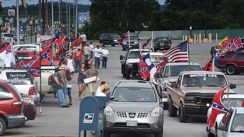 Staff photo by Tim Barber
Dozens of vehicles park and fly the Confederate colors along Highway 2A in the Fort Oglethorpe late Friday afternoon. 