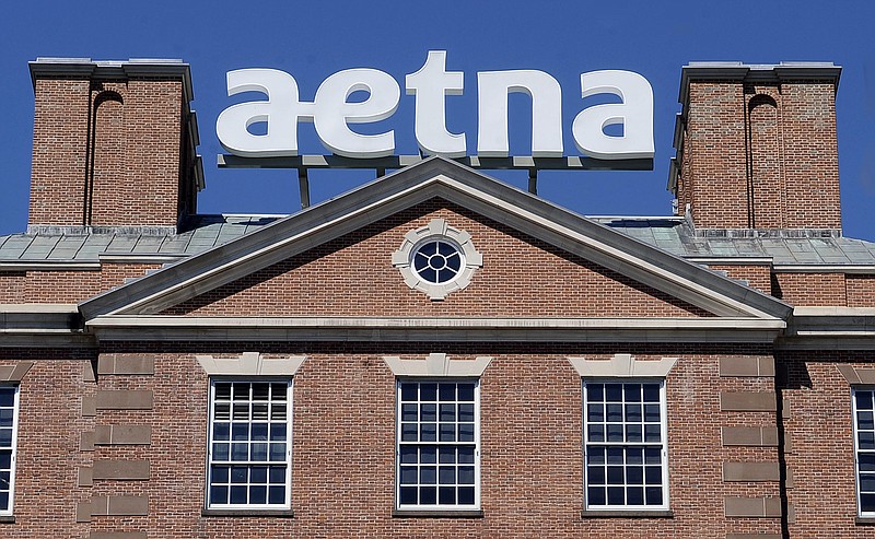 
              FILE  - In this Tuesday, Aug. 19, 2014, file photo, a sign for Aetna Inc., sits atop a building at the company headquarters in in Hartford, Conn. Health insurer Aetna Inc. has made a deal to buy competitor Humana Inc. in a $37 billion deal the companies say would create the second-largest managed care company, it was announced Friday, July 3, 2014. (AP Photo/Jessica Hill, File)
            