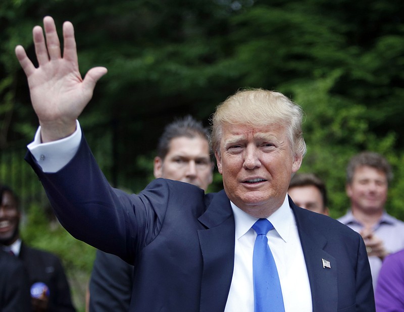 Republican presidential candidate Donald Trump waves as he arrives at a house party in Bedford, N.H., in this June 30, 2015, photo.