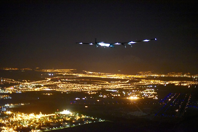 In this image released by Solar Impulse 2, the solar powered plane, piloted by Andre Borschberg approaches Honolulu Airport in Hawaii early Friday, July 3, 2015, after a record-breaking five-day journey across the Pacific Ocean from Japan.