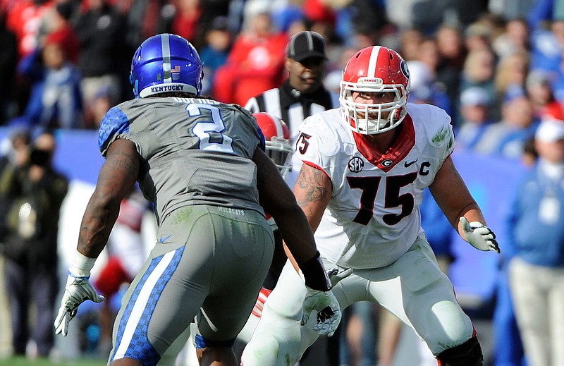 UGA photo/John KelleyGeorgia right tackle Kolton Houston, shown last year getting ready to vie with Kentucky defensive end Alvin "Bud" Dupree, is prepping for his third season with the Bulldogs after being ineligible for the first three.