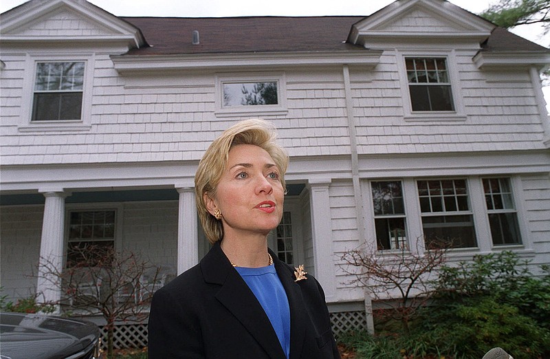Hillary Clinton, shown in front of her five-bedroom Chappaqua, N.Y., home in 1999, is not and has not been "dead broke" as she portrayed her and her husband to be before they left the White House.