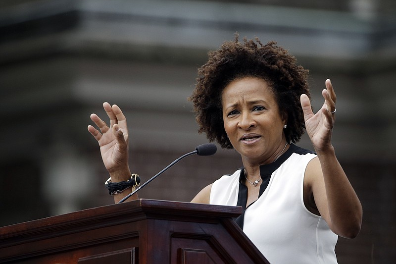 
              Wanda Sykes speaks during the National LGBT 50th Anniversary Ceremony, Saturday, July 4, 2015, in front of Independence Hall in Philadelphia. The event marks the 50th anniversary of a protest outside Independence Hall that would be a milestone in the fight for gay rights. (AP Photo/Matt Rourke)
            