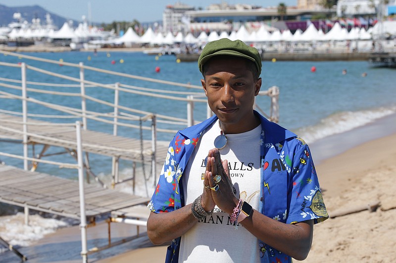 Photo by Joel Ryan/Invision/AP.Musician Pharrell Williams wears his Apple Watch Edition while posing for photographers during a photo call for the film "Dope." Williams is one of many actors, musicians and athletes who were seen wearing pre-release models of the device prior to its launch.