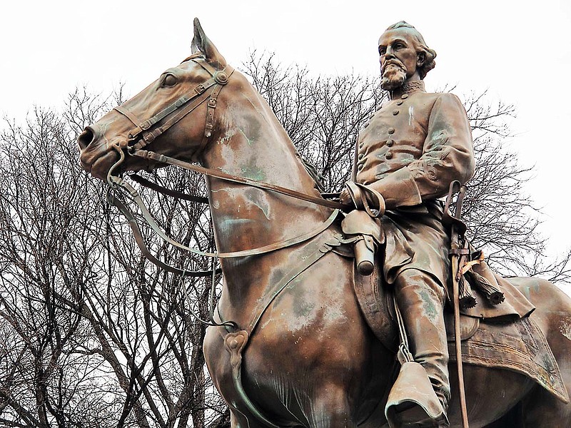 A statue of Nathan Bedford Forrest sits on a concrete pedestal at a park named after the confederate cavalryman on Wednesday, Feb. 6, 2013 in Memphis Tenn. The Memphis City Council has voted to rename Forrest Park and two other Confederacy-themed parks. (AP Photo/Adrian Sainz)