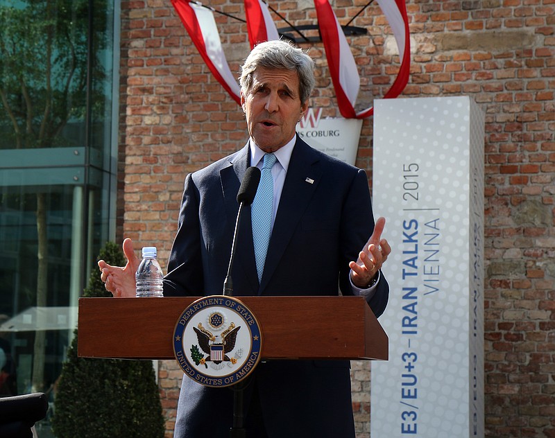 
              U.S. Secretary of State John Kerry informs the media in front of Palais Coburg where closed-door nuclear talks with Iran take place in Vienna, Austria, Sunday, July 5, 2015. (AP Photo/Ronald Zak)
            