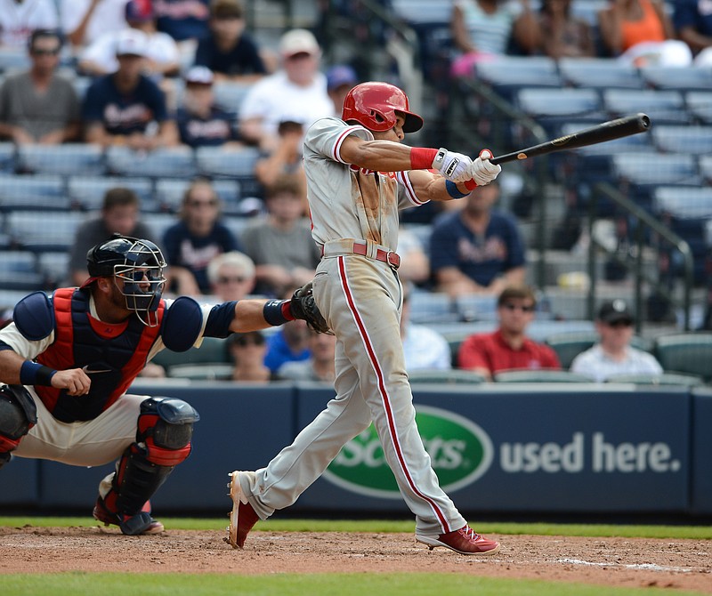 Philadelphia Phillies second baseman Cesar Hernandez (16) hits a single in the tenth inning of his game against the Atlanta Braves Sunday, July 5, 2015, in Atlanta. Hernandez scored on a Carlos Ruiz double later in the inning. Philadelphia won 4-0.