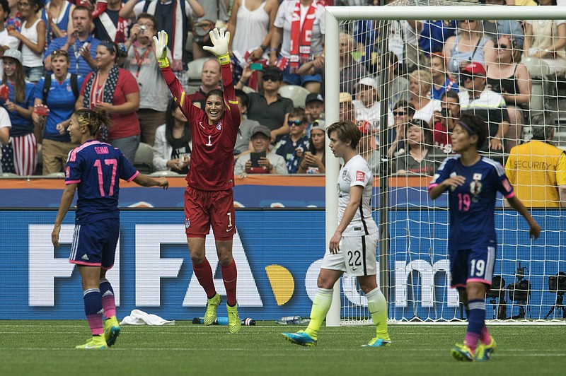 Team USA goalkeeper Hope Solo (1) celebrates their win over Japan after the final whistle of the game at the FIFA Women's World Cup soccer championship in Vancouver, British Columbia, Canada, Sunday, July 5, 2015. (Jonathan Hayward/The Canadian Press via AP) MANDATORY CREDIT