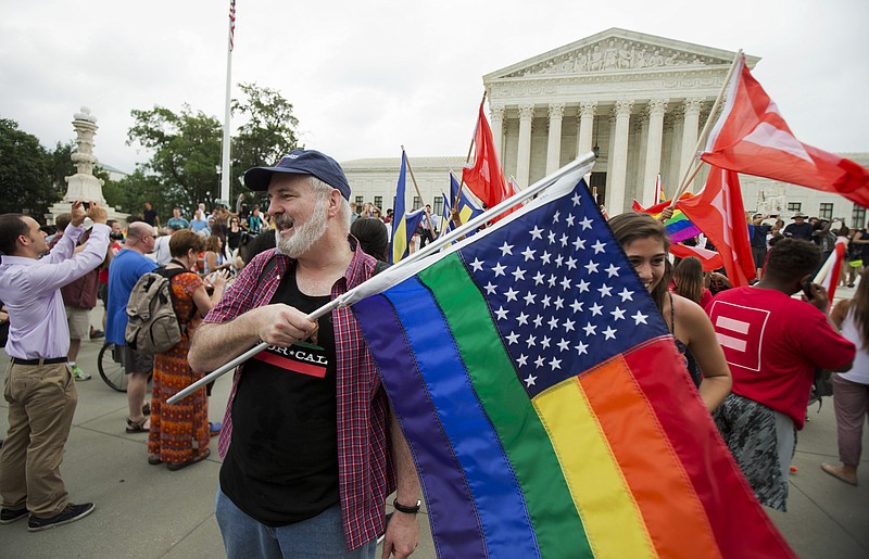 
              FILE - In this June 26, 2015 photo, supporters celebrate outside the Supreme Court in Washington, Friday, June 26, 2015 after the court declared that same-sex couples have a right to marry anywhere in the United States. It was 2004 when Massachusetts became the first state to allow same-sex couples to marry. Eleven years later, the Supreme Court has now ruled that all those gay marriage bans must fall and same-sex couples have the same right to marry under the Constitution as everyone else. (AP Photo/Manuel Balce Ceneta)
            